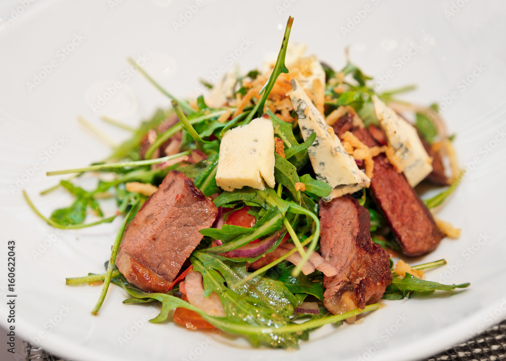 Meat and cheese salad on restaurant table Meat and cheese salad on restaurant table