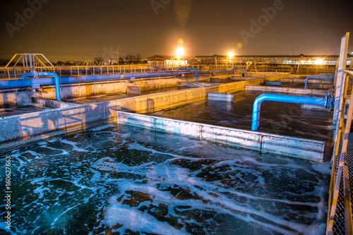 Fotografie Modern wastewater treatment plant of chemical factory at night