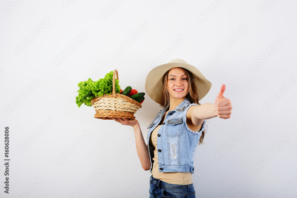 Smiling healthy woman thumbs up, holding a basket with vegetables, food, summer photo Smiling healthy woman thumbs up, holding a basket with vegetables, food, summer photo