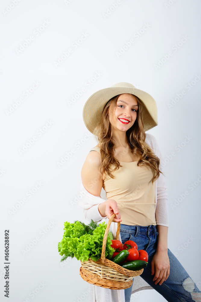 Beautiful young woman with wicker basket on white background Beautiful young woman with wicker basket on white background