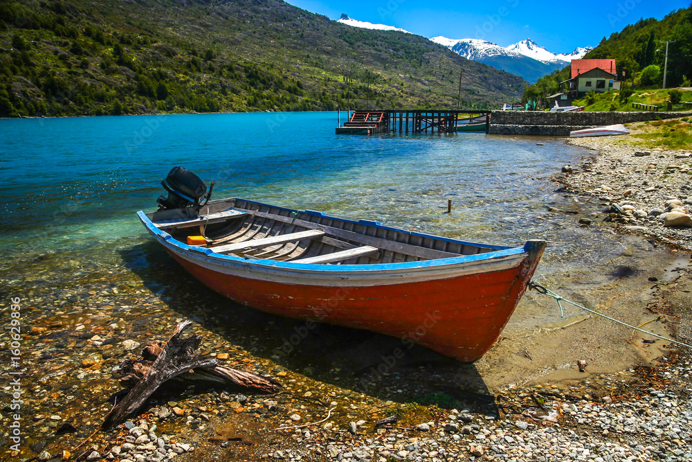 Small boat on Patagonian lakeshore