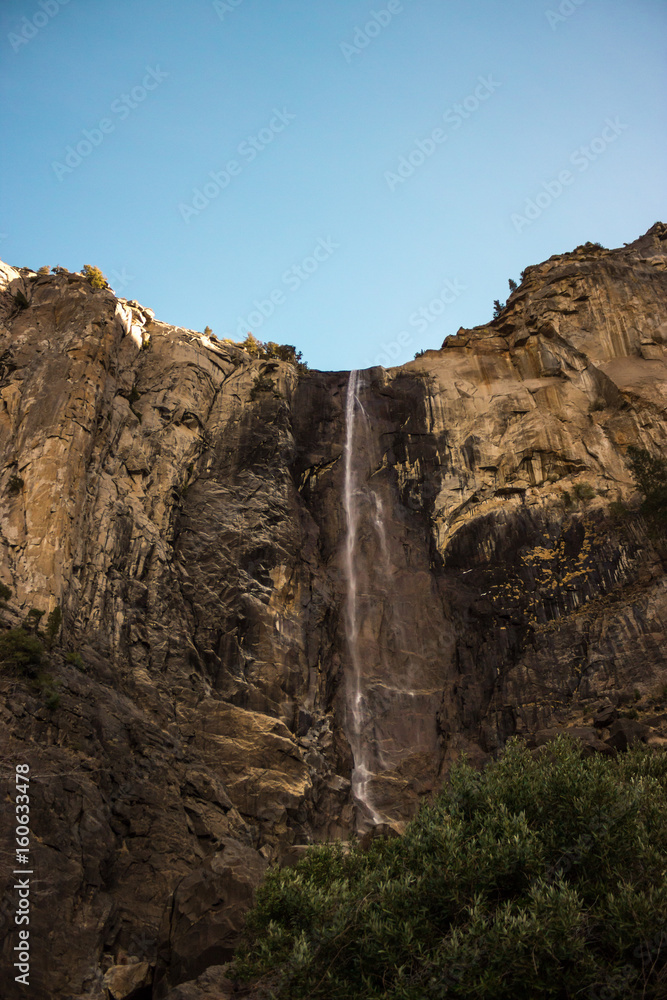 Photo of Bridalveil Fall against blue sky at Yosemite National Park, California, CA