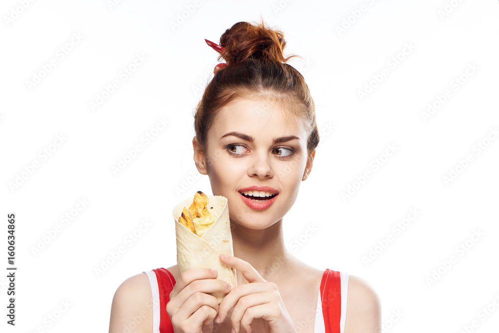 Woman hungry, woman holds pita bread on isolated background portrait