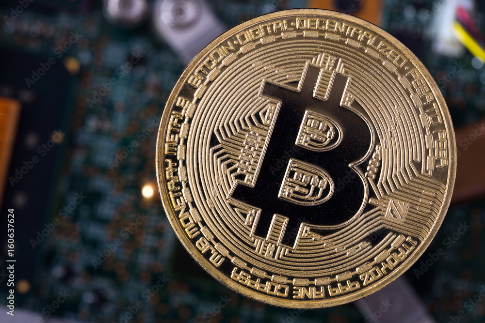 golden bitcoin and  computer chip in background