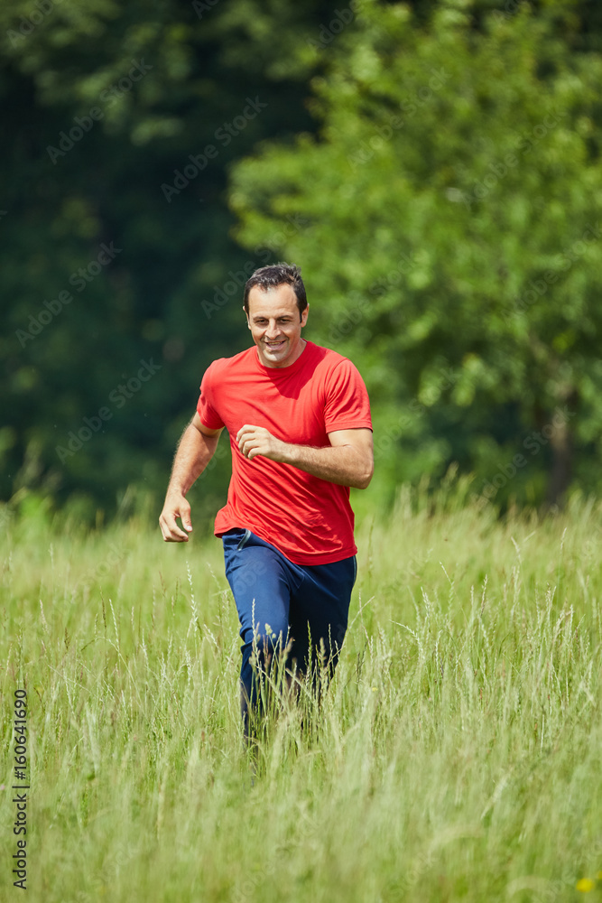 Man trail running by the forest Man trail running by the forest