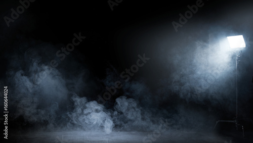 Conceptual image of a dark interior full of swirling smoke