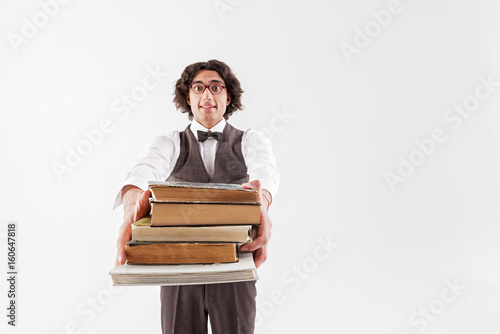 Cheerful young male bookworm proposing to read with him