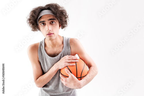 Scared thin male basketball player photo