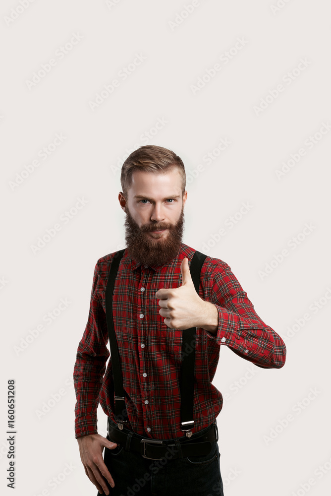 Good job. You right. Like concept. Stylish beard man in red shirt show yes. Portrait of attractive male show thumb up. Endorsing concept. Good job. You right. Like concept. Stylish beard man in red shirt show yes. Portrait of attractive male show thumb up. Endorsing concept.