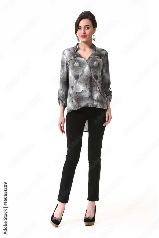 Fototapeta premium fashion indian business woman in formal blouse black jeans high heel shoes full body photo isolated on white