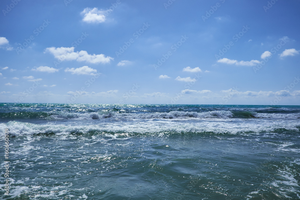The Mediterranean Sea with raging waves on a summer sunny day. Valencia, Alicante, Spain.ean