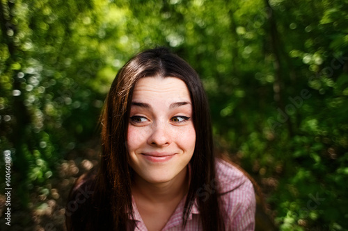 Portrait of cute lovely funny young smiling woman