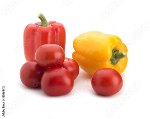 Multi-colored sweet pepper and red tomatoes on a white background