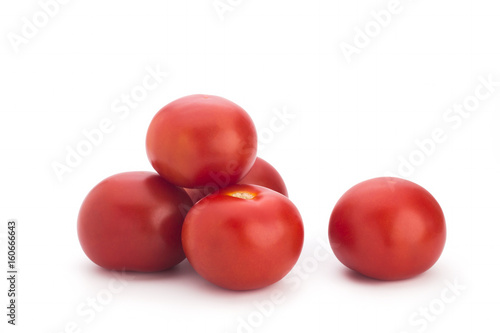 Red tomatoes isolated on white background © Elena