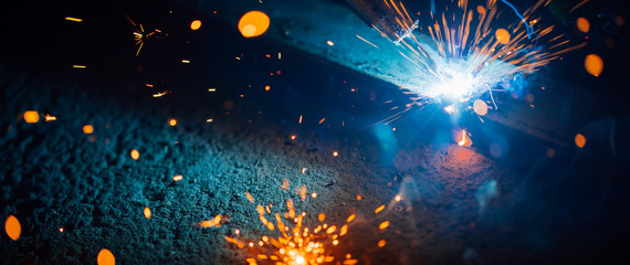abstract welding sparks light, industrial background