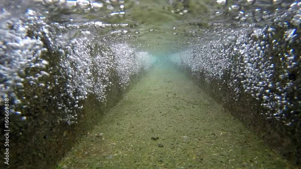 Under water. Water is falling on a water treatment canal. A water purification plant located in Taipei, northern Taiwan. Under water. Water is falling on a water treatment canal. A water purification plant located in Taipei, northern Taiwan.