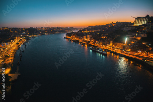 Night view of the Douro river from Dom Luis I bridge, Porto, Portugal.
