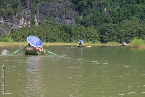 Tourists traveling in small boat along the River