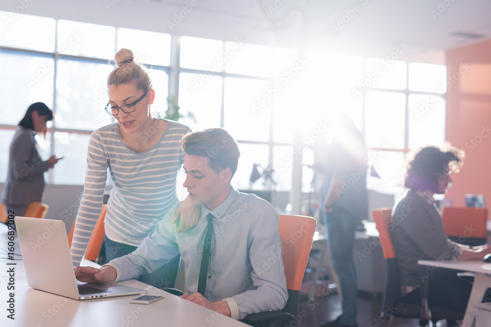 Two Business People Working With laptop in office Two Business People Working With laptop in office
