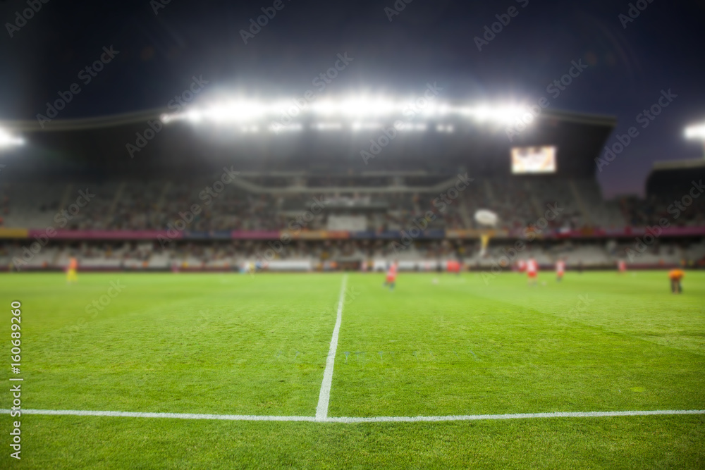 Fototapeta premium wieczorem stadion arena boisko do piłki nożnej niewyraźne tło