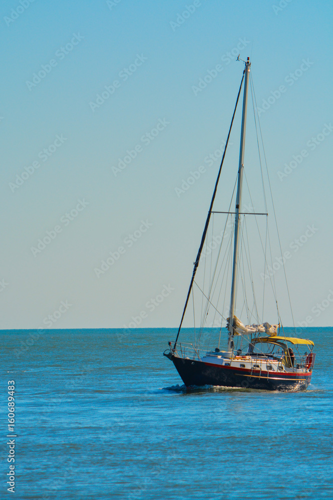 A sail boat on the Gulf of Mexico heading toward Johns Pass in Florida.
