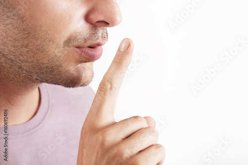 Fotografia Finger on lips - silent gesture
