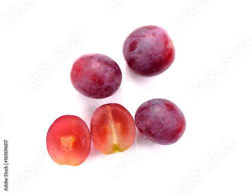 Red grape sliced in a half isolated on a white background.