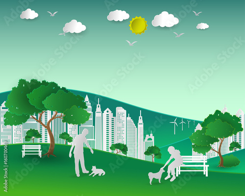 Concept of eco with nature and building,couple love dogs happy in the city park