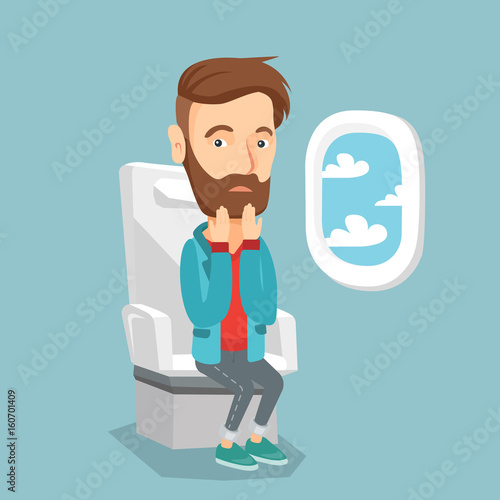 Young man suffering from fear of flying.