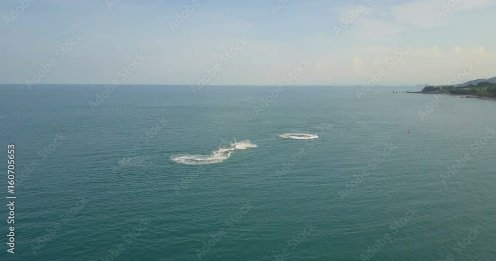 Aerial View of Jet Ski Riding in Sea Aerial View of Jet Ski Riding in Sea