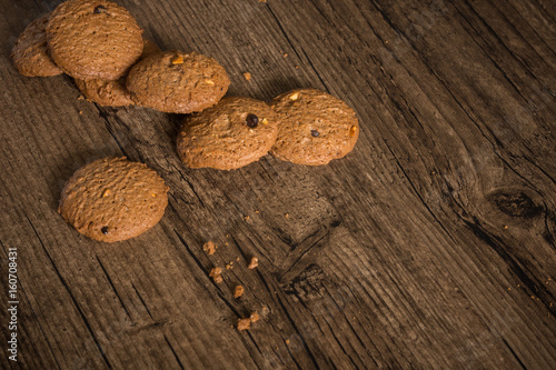 Delicious coffee cookie with copy space on wooden background.
