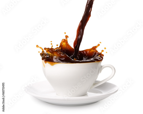 Pouring coffee into cup with splashing., Isolated on white background. © Theeradech Sanin