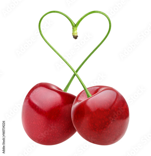 Isolated cherries. Heart shape from two cherries over white background