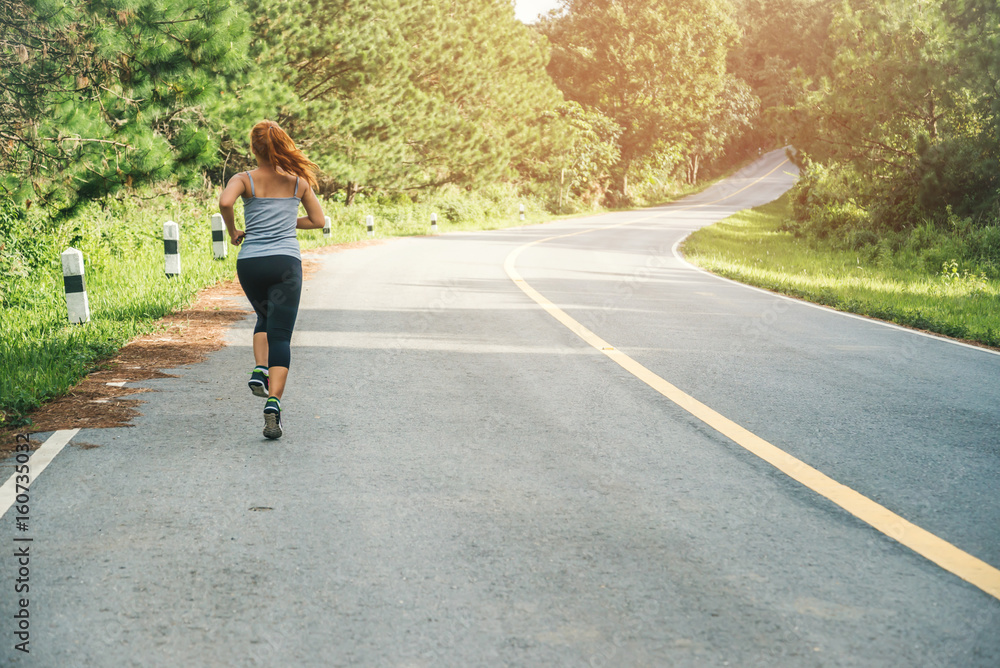 Women exercise on the street. Nature park. Asian women