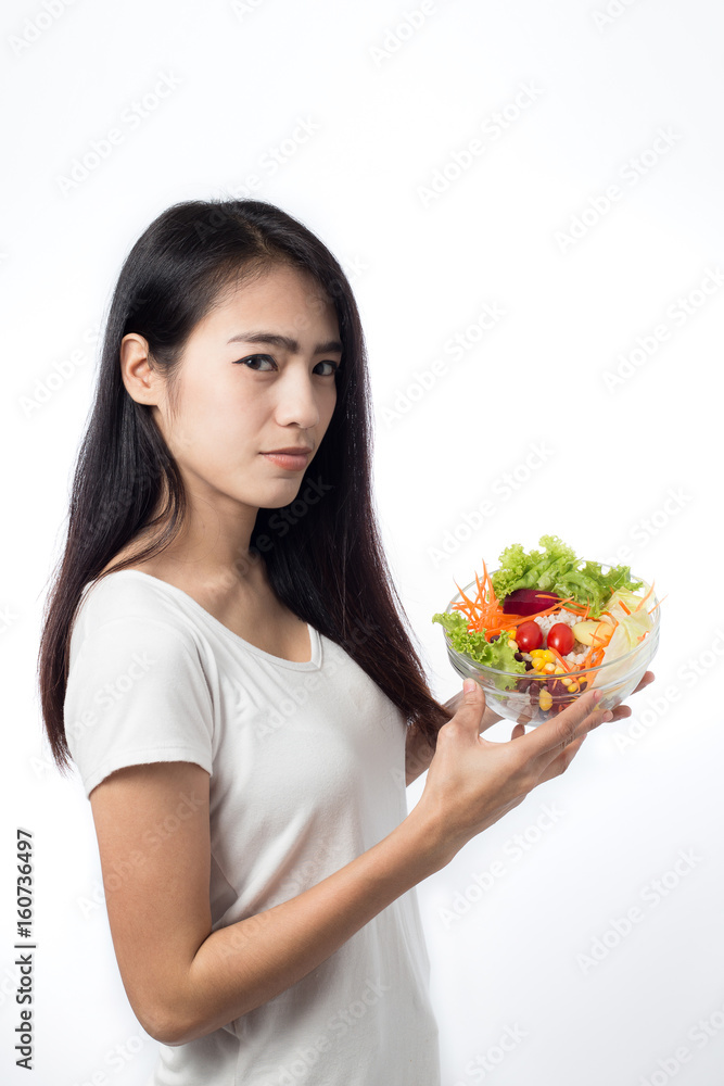 Portrait of beautiful asian young woman eating vegetable salad Isolated on white background. Portrait of beautiful asian young woman eating vegetable salad Isolated on white background.