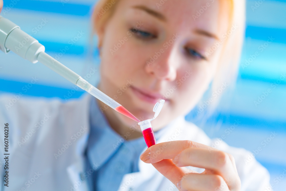 Laboratory assistant in the medical laboratory control a microbiological analysis of the blood. Using a pipette and a test tube in the laboratory Laboratory assistant in the medical laboratory control a microbiological analysis of the blood. Using a pipette and a test tube in the laboratory