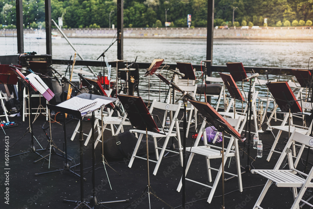 Musical instruments on the river bank in warm summer evening Musical instruments on the river bank in warm summer evening