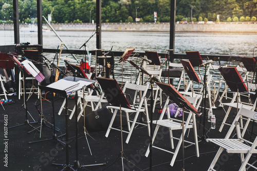 Musical instruments on the river bank in warm summer evening