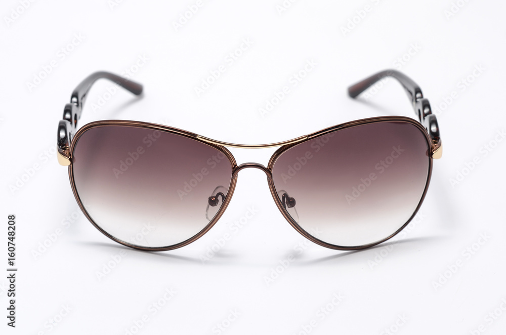 Sunglasses in an iron frame with brown glass isolated on white Sunglasses in an iron frame with brown glass isolated on white