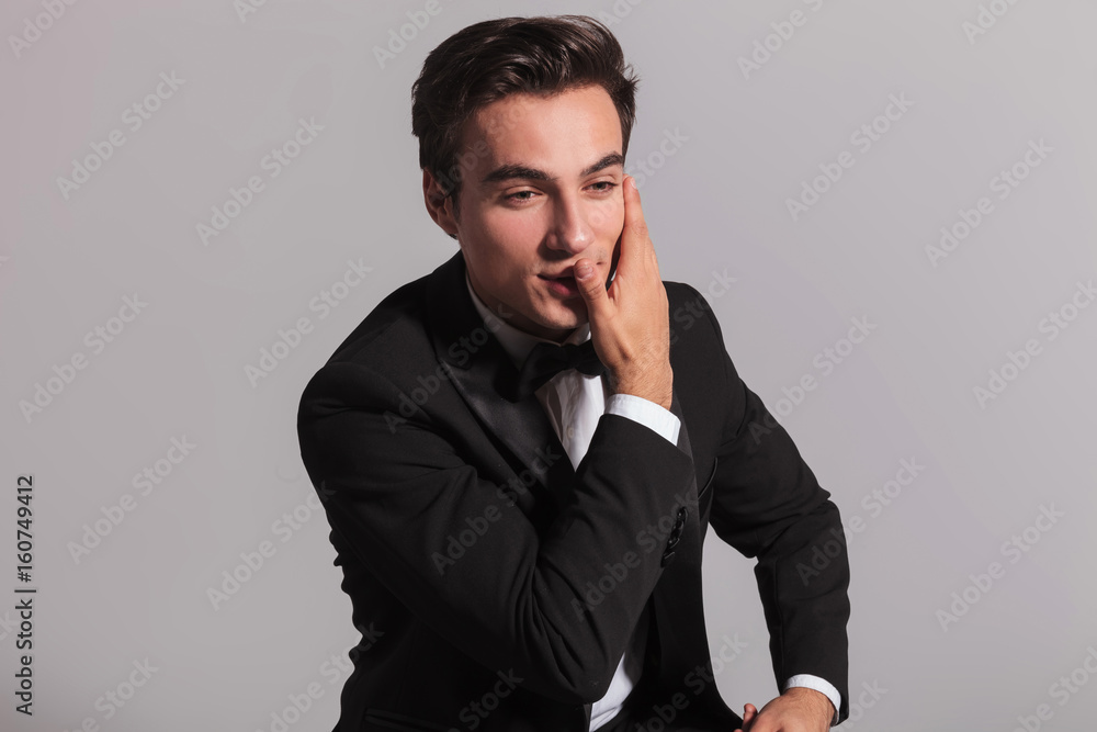 smiling elegant man covering his face with palm smiling elegant man covering his face with palm