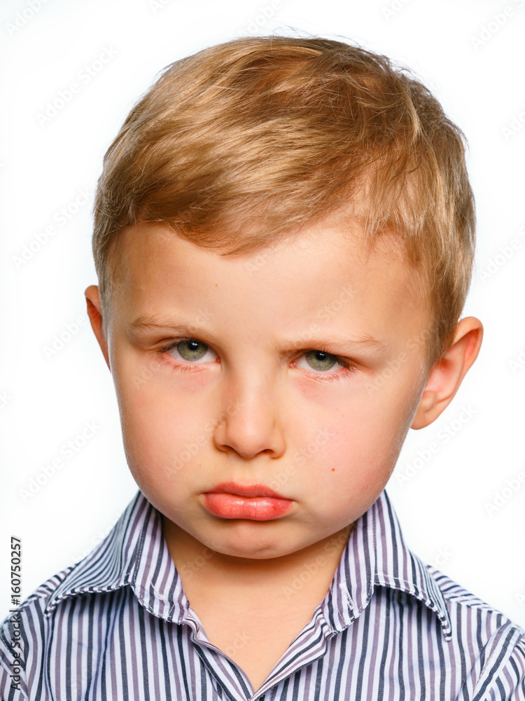 His first experience to make photo for passport or ID card. Emotionally grimacing little boy with blond hair and bright green eyes. White background. His first experience to make photo for passport or ID card. Emotionally grimacing little boy with blond hair and bright green eyes. White background.