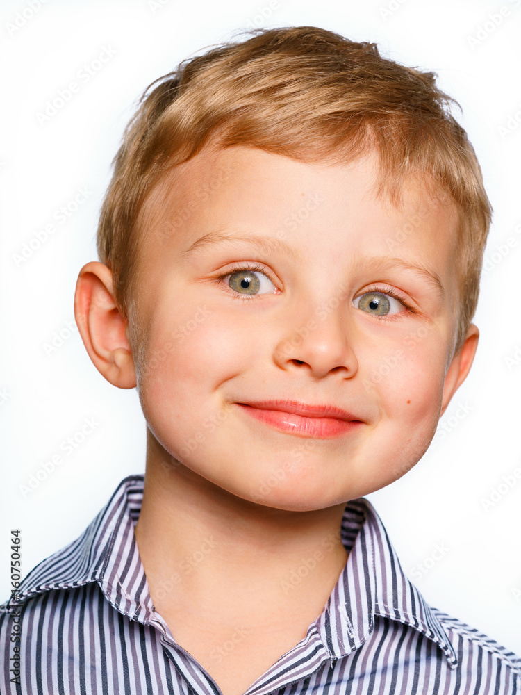 His first experience to make photo for passport or ID card. Emotionally grimacing little boy with blond hair and bright green eyes. White background. His first experience to make photo for passport or ID card. Emotionally grimacing little boy with blond hair and bright green eyes. White background.
