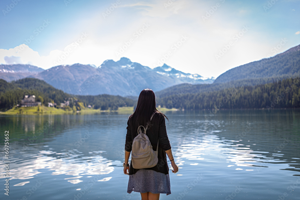 Beautiful tourist girl with backpack in nature