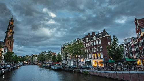 The most famous canals and embankments of Amsterdam. General view of the cityscape and traditional Netherlands architecture. 4K Time Lapse Footage.