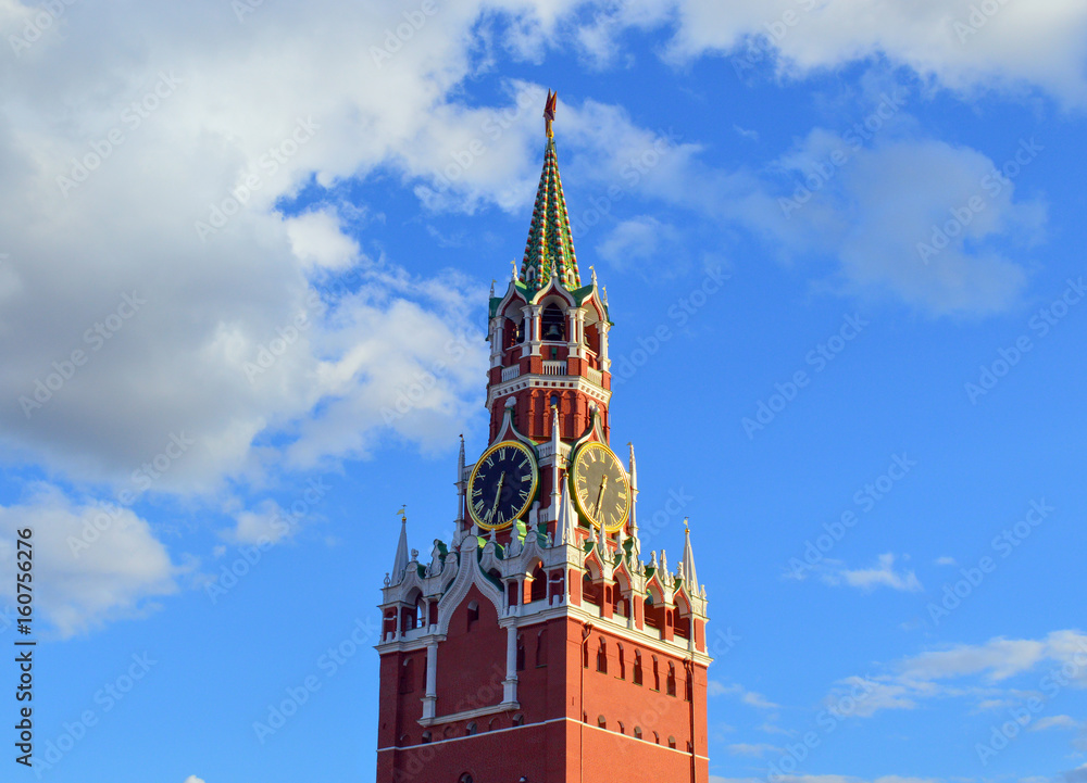 Moscow Kremlin clock on Spasskaya tower with soviet star on top, symbol of Moscow and famous architectural landmark Moscow Kremlin clock on Spasskaya tower with soviet star on top, symbol of Moscow and famous architectural landmark