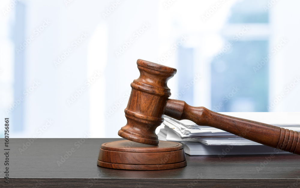 judge hammer on white paper and table judge hammer on white paper and table