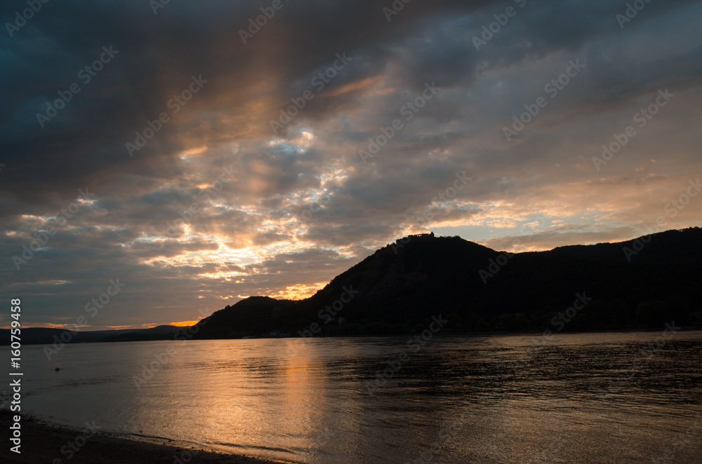 rays of sunshine on the beach by the river in summer morning rays of sunshine on the beach by the river in summer morning