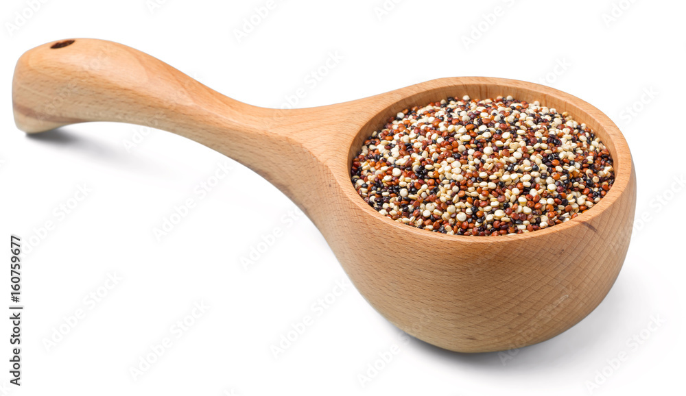 dried quinoa in the wooden spoon on the white background, (large depth of field, taken with tilt shift lens) dried quinoa in the wooden spoon on the white background, (large depth of field, taken with tilt shift lens)
