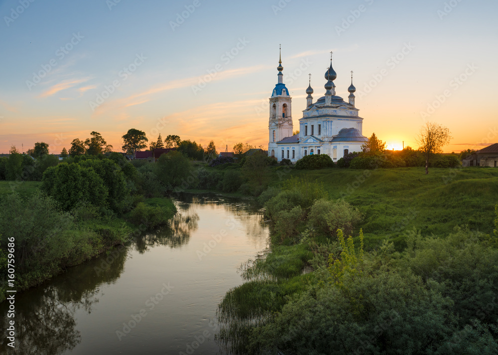 Sunset in the village Savinskoye, Yaroslavl region. Russia. The Church Of The Nativity Of The Blessed Virgin.