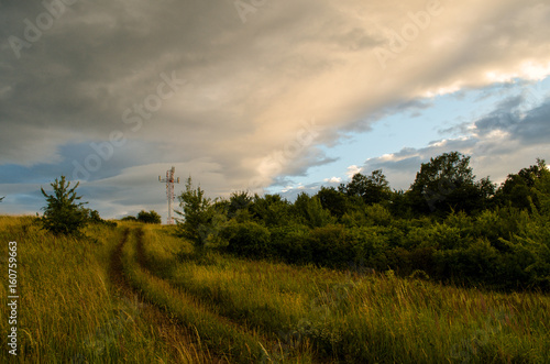 Cloudy sunny landscape scene in nature in the summer while hiking 